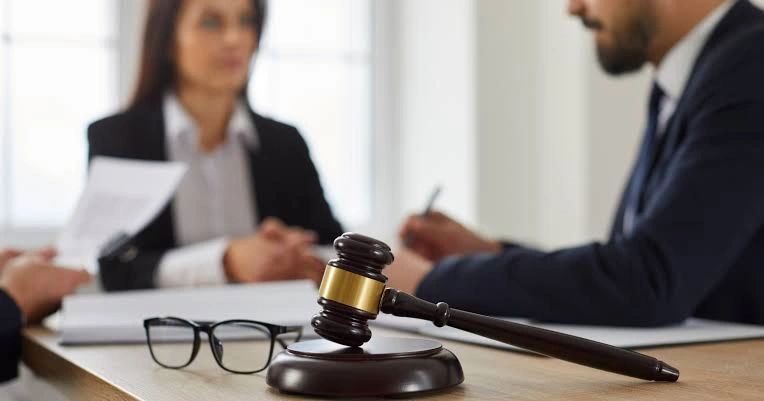 Gavel with attorneys meeting background | Robinson Investigations & Conflict Resolution